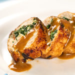 Cheesy juicy stuffed chicken breasts filled with bacon, ricotta and swiss cheese, pan fried until golden and served with a lemony white wine sauce.