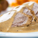 Perfectly cooked juicy pork tenderloin marinated in mustard and thyme served with a white wine cream sauce.  This sauce is perfect for the pork and any sides such as steamed potatoes and carrots.