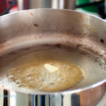 Melting butter in a saucier pan.