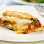 Stuffed chicken breast with spinach and cheese. One of our best baked chicken breast recipes. Stuffing is easy with the butterfly technique used in the recipe.