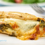 Stuffed chicken breast with spinach and cheese. One of our best baked chicken breast recipes. Stuffing is easy with the butterfly technique used in the recipe.