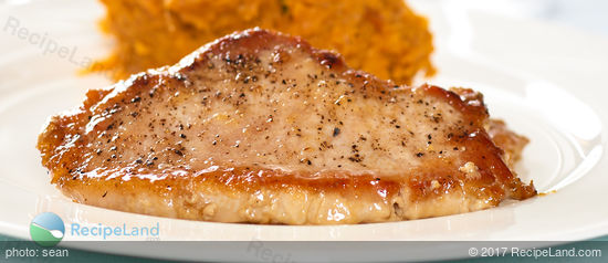 Juicy pork chop, ready for smothering with glaze