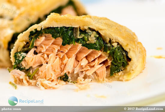 Juicy <a href="/how-to/what-perfect-internal-temperatu-297" title="Perfect internal temperature for salmon">salmon</a> with spinach stuffed inside of flaky puff pastry.