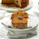 A sour cream coffee cake recipe with a ribbon of cherry pie filling topped with a delicious almond crumble.