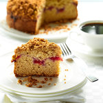 A sour cream coffee cake recipe with a ribbon of cherry pie filling topped with a delicious almond crumble.