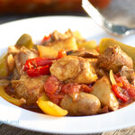 Delicious and easy to make. Chunks of chickens, sausages, and fresh veggies are cooked with stewed tomatoes, which makes lots of tasty sauce. Serve it over a bed of rice or spaghetti. YUM!