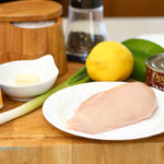 Ingredients for making chicken breasts Neptune assembled on a cutting board