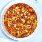 This delicious savory tart is made with roasted cherry tomatoes, feta cheese, and fresh herbs. It's cheesy, sweet, juicy and very tasty. You can have it as an appetizer or a main dish!