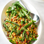 Sautèing asparagus with bacon (pancetta) and leeks is a perfect way to cook asparagus and keep it perfectly tender-crisp and finished with pine nuts and aromatic garlic, lemon and orange zest makes this side a sophisticated, delicious variety of textures and flavors.