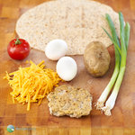 Skip the fast food queue - it's easy to make your own breakfast wraps at home. Crispy home fried potatoes, egg, cheese and a sausage patty wrapped up in a crispy tortilla.