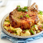 Baked pork chops with bacon and egg fried rice. Browned on the stovetop and finished in the oven for tender pork.