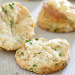 Turn garlic scapes into fluffy, cheesy buttermilk biscuits. The garlic scapes add a fresh mild hint of garlic to the savory biscuits which is perfectly complimentary.
