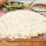 Turn garlic scapes into fluffy, cheesy buttermilk biscuits. The garlic scapes add a fresh mild hint of garlic to the savory biscuits which is perfectly complimentary.