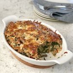 A great way to use up day old bread. A savory version of bread pudding with spinach and mushrooms that's cheesy delicious.