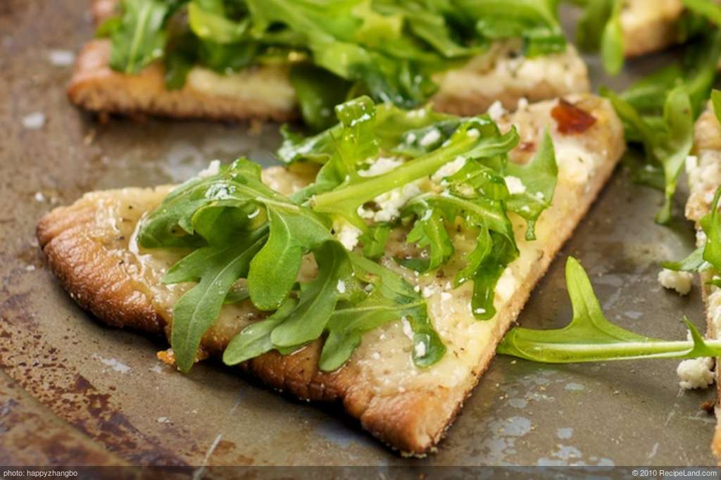 Cheesy and Garlicky White Pizza topped with Fresh Arugula  recipe