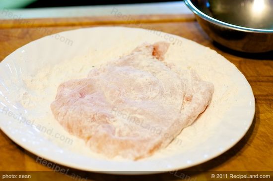 Dredge the breast in the seasoned flour