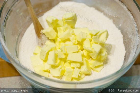 Cut up the butter and add to the flour