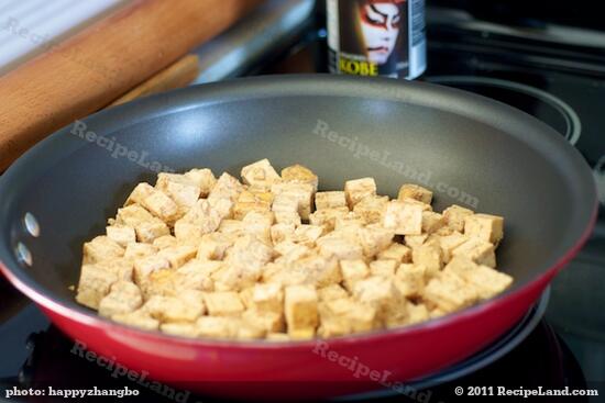 Place the marinated tofu in the pan