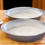 Flour the pans