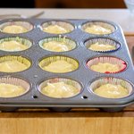 Divide batter evenly among prepared muffin cups