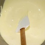 A close-up of the egg yolk and sugar mixture.