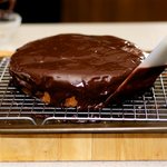 Use ganache to give the uncovered spots some touch.