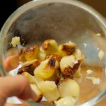 Squeeze roasted garlic cloves into a small bowl.