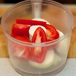 Add tomatoes and onions to your food processor