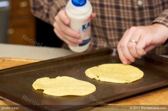 Season the corn tortillas and pop them in the oven