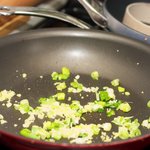 Heat another 2 teaspoons oil in a wok or large nonstick skillet over medium-high heat.