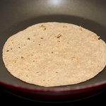 Put 1 tortilla in the skillet and toast until soft and puffed slightly at edges, 1 minute...