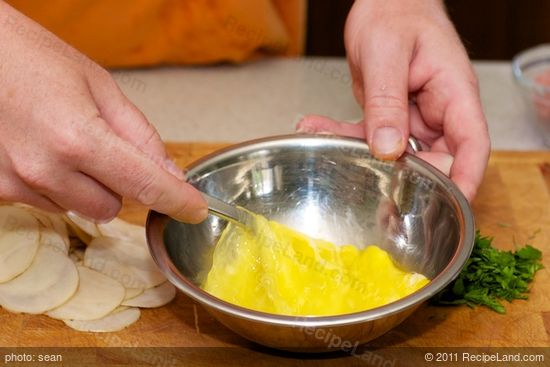 Whisk eggs with a fork