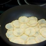 Add the potatoes to the pan and cook