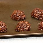 With a large spoon, make cookies on oiled sheet.