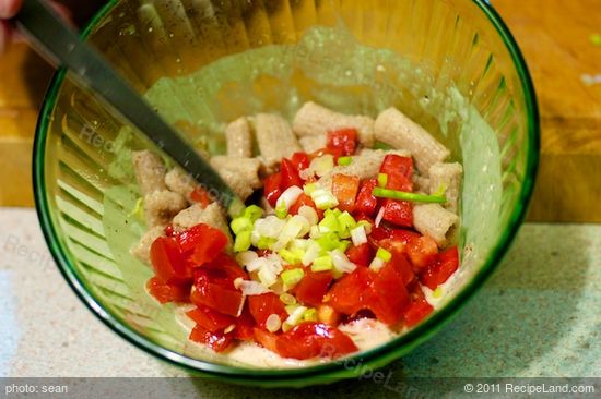 Add the tomatoes and cooked pasta