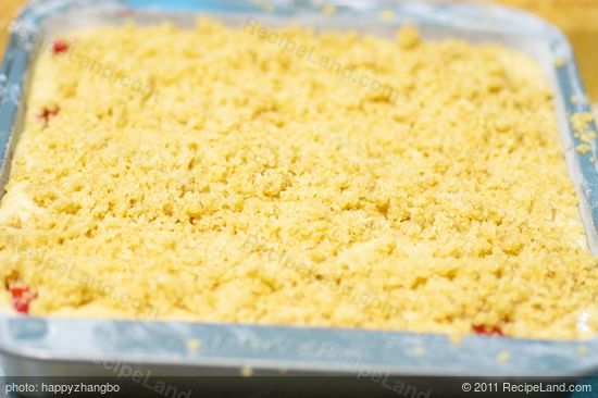 Sprinkle the prepared topping evenly over batter, and lay foil on lower rack to catch any juicy fruit spillovers.