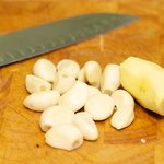First, let's peel the garlic and ginger...