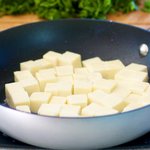 Add the paneer cubes to a hot pan (with a bit of oil)