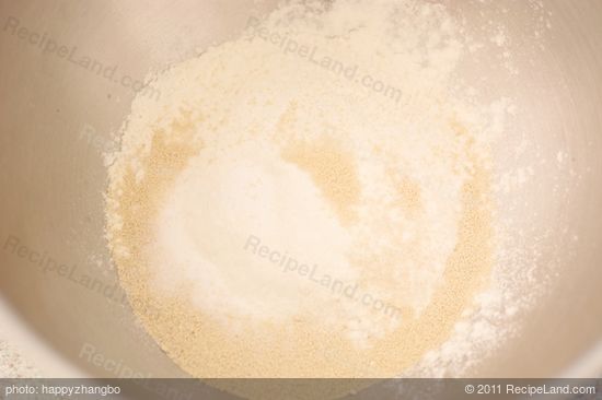 Add 1 cup flour, yeast, and salt in a mixing bowl, stir until well mixed...