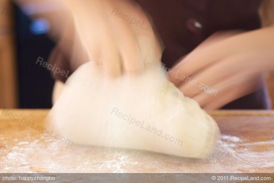 Continue to work in flour until dough is stiff enough to knead...