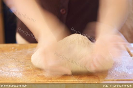 Turn the dough over and keep kneading...