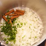 Cook chopped onions, peppers and broken cinnamon stick in a large pot...