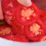 then add the sliced tomatoes...