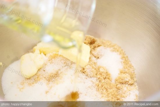 Add butter, oil and sugar in a large mixing bowl with an electric mixer...