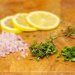 Slice the lemon and prep the herbs, don't forget to keep the stems!