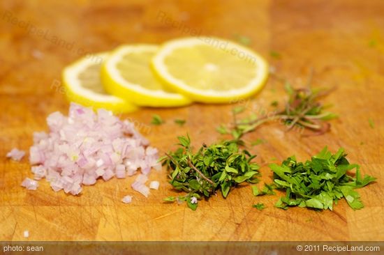 Slice the lemon and prep the herbs, don't forget to keep the stems!