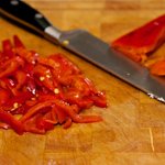 Slice the roasted bell peppers...