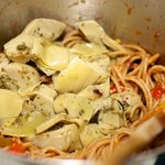 Add the marinated artichoke hearts...