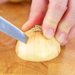 Cut two small X's near the stem or root of each onion to allow steam to escape and to help prevent the outer ring from rising...