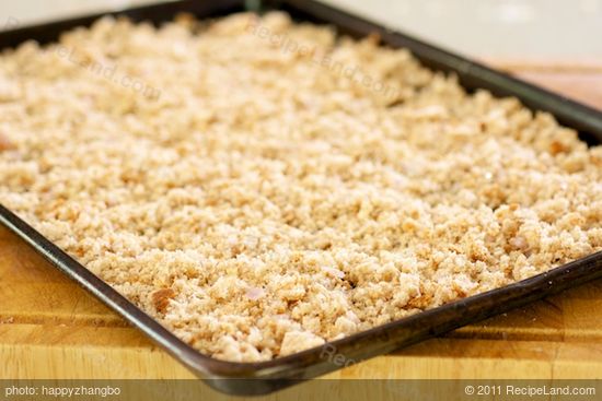 Spread the mixture evenly on the baking sheet.